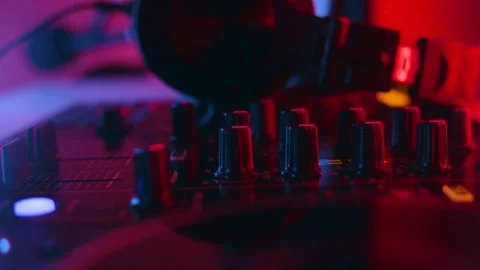 DJ mix studio audio tracks mixing buttons pads decks mixing console frequencies 스톡 동영상 170025376