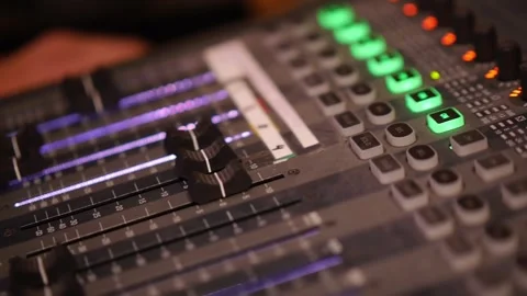 DJ Mixer Console with Glowing Knobs in Neon Light Close Up Stock Footage 336782801