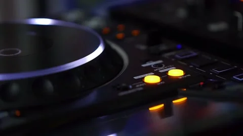 DJ Mixer Console with Glowing Knobs in Neon Light Close Up Vidéo 336782989
