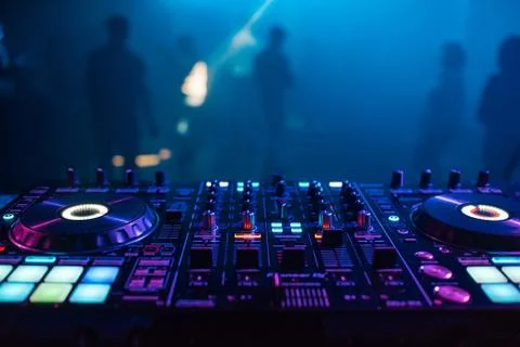 DJ mixer on the table background the night club Stock Photos