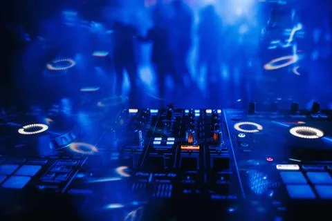 DJ mixer on the table background the night club Stock Photos