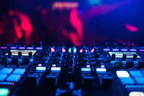 DJ mixer on the table background the night club Stock Photos