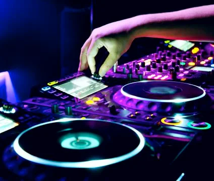 Dj mixes the track in the nightclub at a party Stock Photos