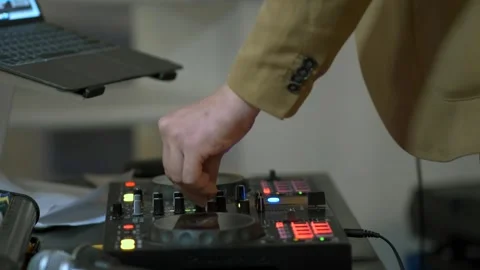 Dj mixes a track on a turntable using a pair of hands at a party. Close-up. Stock Footage 274063472