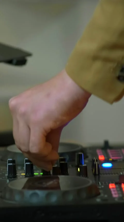 Dj mixes a track on a turntable using a pair of hands at a party. Close-up. Stock Footage 306147674