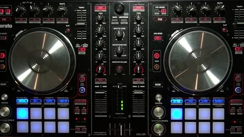 DJ Mixing Music with Digital Controller Turning Knobs overhead Party 動画素材 136345542