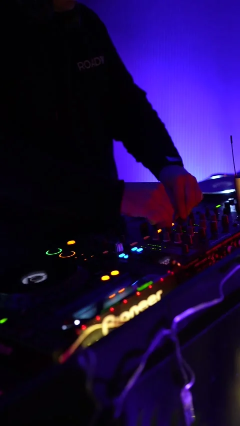 Dj mixing music on a turntable console at a nightclub party Stock Footage 333562774