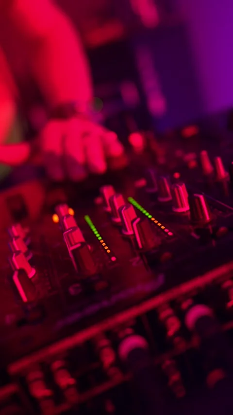 Dj mixing music on a turntable controller at a nightclub party Stock Footage 333562949