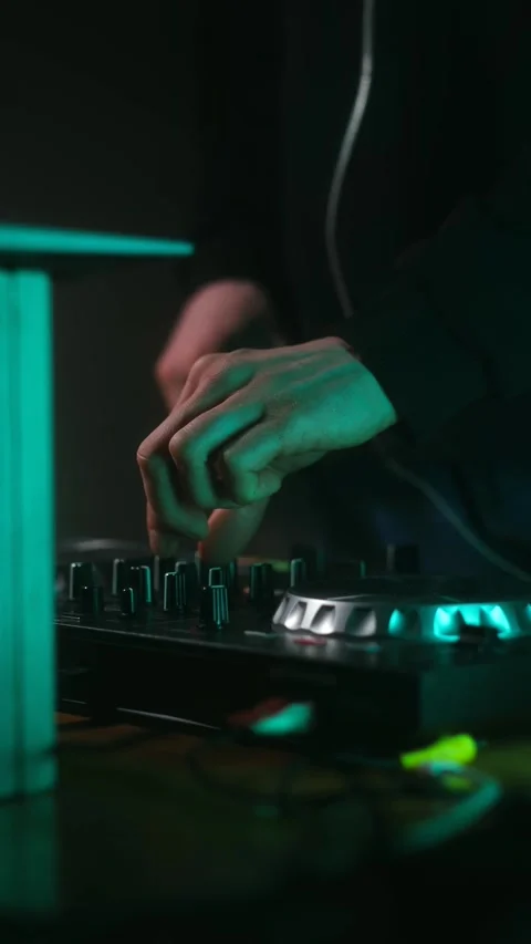 Dj mixing music using controller at nightclub party Stock Footage 337830608
