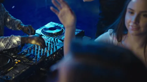 DJ moving controls on mixing console Stock Footage 170184073