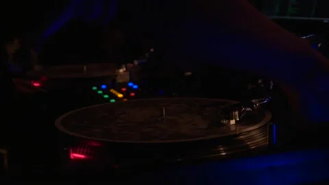 DJ operating his controller and turntables at wedding party. Stock Footage 149076690