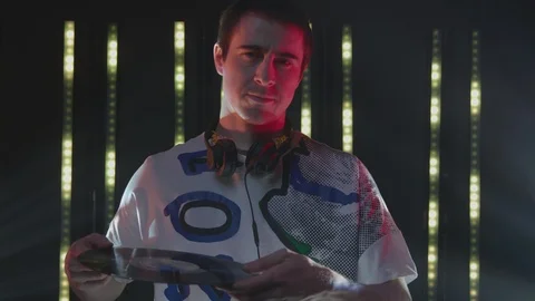 Dj placing a vinyl record on the turntable at nightclub Stock Footage 87151630