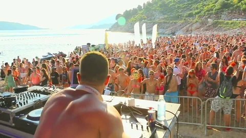 DJ play the music on the party at the beach Stock Footage