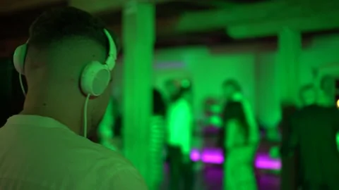 DJ playing for blurred out crowd at a wedding party Stock Footage 232764361
