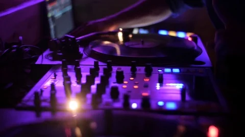 Dj playing closup Hands of DJ tweak various track controls on dj's deck Stock Footage 80369385