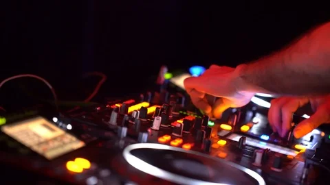 Dj playing dance music on night party Stock Footage
