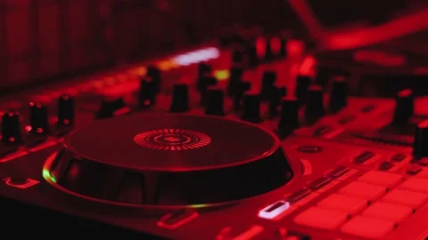 Dj playing music at the mixer controller in a night club Stock Footage 166246126