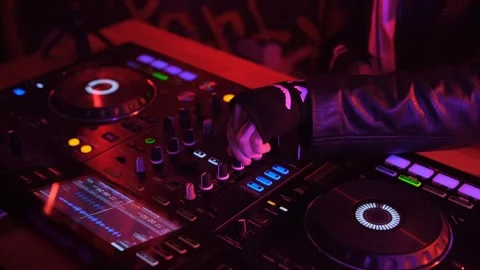 Dj playing music at the mixer controller in a night club Stock Footage 269987338
