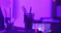 Dj playing music at party, glasses with alcohol drinks standing on bar counter HD Footage