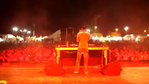 DJ playing music on stage Stock Footage