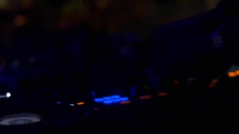 DJ playing  table mixer at night club party Stock Footage 255680836