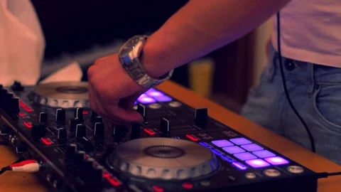 DJ plays music on console Stock Footage 70098794