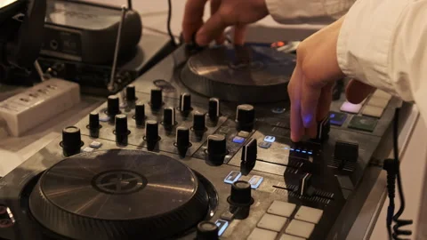 DJ Plays Music Using DJ Mixing Controller at Night Party Stock Footage 248315341