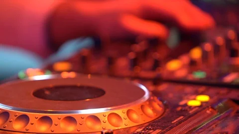 DJ plays at the remote control in a disco club Stock-Footage 128271844