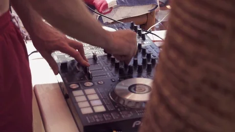 Dj Pushing Knobs In A Console Summer Pool Party Young People Having Fun Video stock 102611340