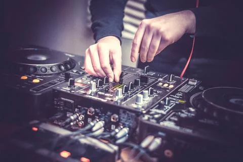 DJ at the remote control. Mixer remote at concert. Musical equipment. Stock Photos