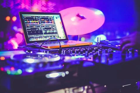 DJ at the remote control. Mixer remote at concert. Musical equipment. Stock Photos