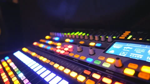 Dj remote or soundboard with knobs and green color equalizer in night club 스톡 동영상 306047212