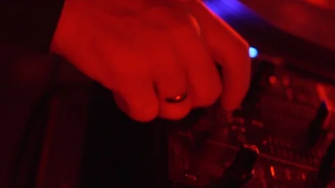 DJ with a ring plays on crossfaders on the controller Stock Footage 122153680