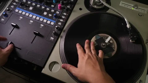 A DJ scratching on turntables. Stock Footage 79332387