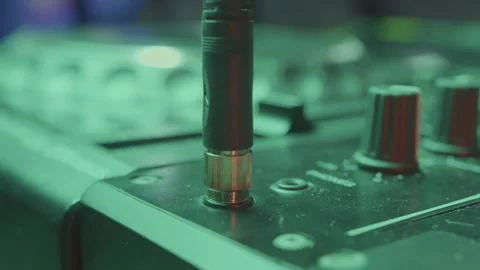 DJ selects appropriate cable and connects to input of mixer Vídeos de archivo 273614737