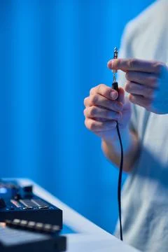 DJ setup closeup, Close view of audio connection process during live performance Stock Photos
