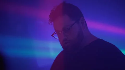 DJ singing and dancing. Man feeling the music at the nightclub. Stock Footage 211061128