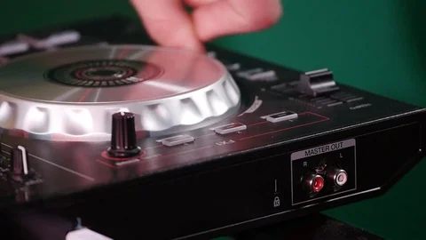 DJ is spinning the disk on the equipment Stock Footage 77403747