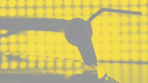 Dj stylus on spinning record, blur light background. Yellow and gray tone Stock Photos