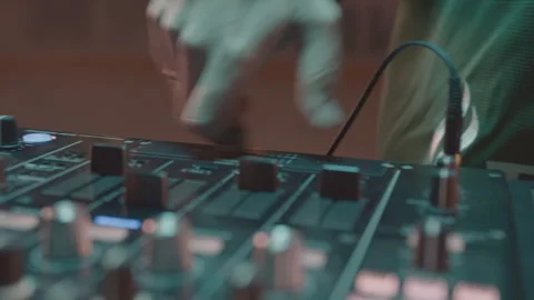DJ switches level on console performing music at party Stock-Footage 268423408