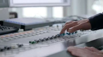 DJ turning the volume up and pushing two buttons Stock Footage 85504055