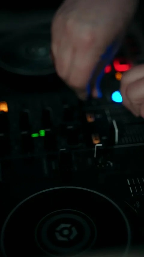 DJ turns the toggle switch on the remote control Stock Footage 273949957