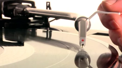 DJ Turntable. Dropping the needle on a spinning vinyl record player Stock Footage 46318425