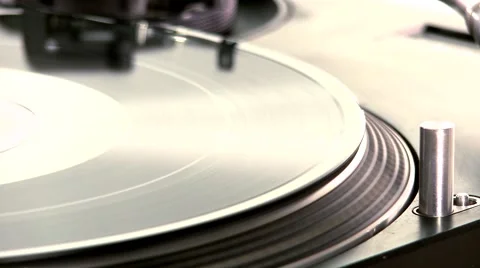 DJ Turntable. Dropping the needle on a spinning vinyl record player Stock Footage 46319300