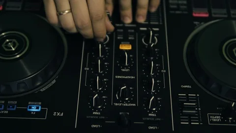 DJ tweak track controls on DJ control panel. Stock Footage 91600737
