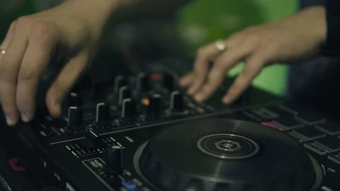 DJ tweak track controls on DJ control panel. Stock Footage 91600813