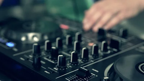 DJ tweak track controls on DJ control panel. Stock Footage 91601125