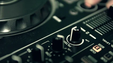 DJ tweak track controls on DJ control panel. Stock Footage 91607599
