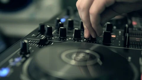 DJ tweak track controls on DJ control panel. Stock Footage 91607820