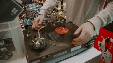 The DJ is twirling the record Stock Footage